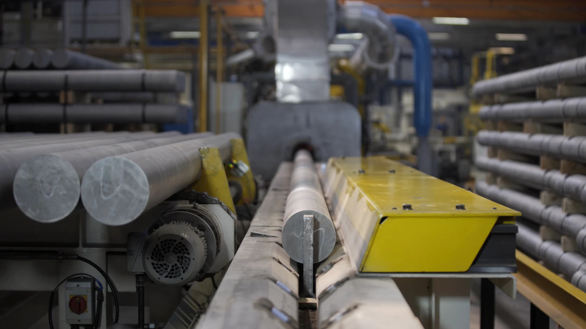 Aluminium billet feedstock entering a processing line